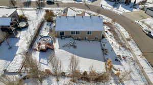 Snowy aerial view with a residential view