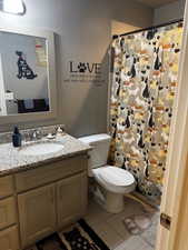 Bathroom featuring vanity and a shower with curtain