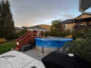 View of pool featuring a patio area and stairway