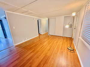 Unfurnished bedroom featuring light wood-type flooring and a closet