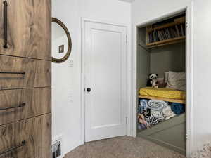 Detailed view of carpet and baseboards