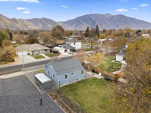 Aerial view of residential area featuring a mountainous background
