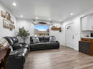 Living area featuring recessed lighting and light wood finished floors
