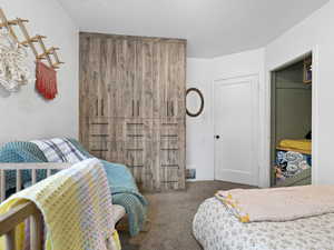 Bedroom with carpet and baseboards