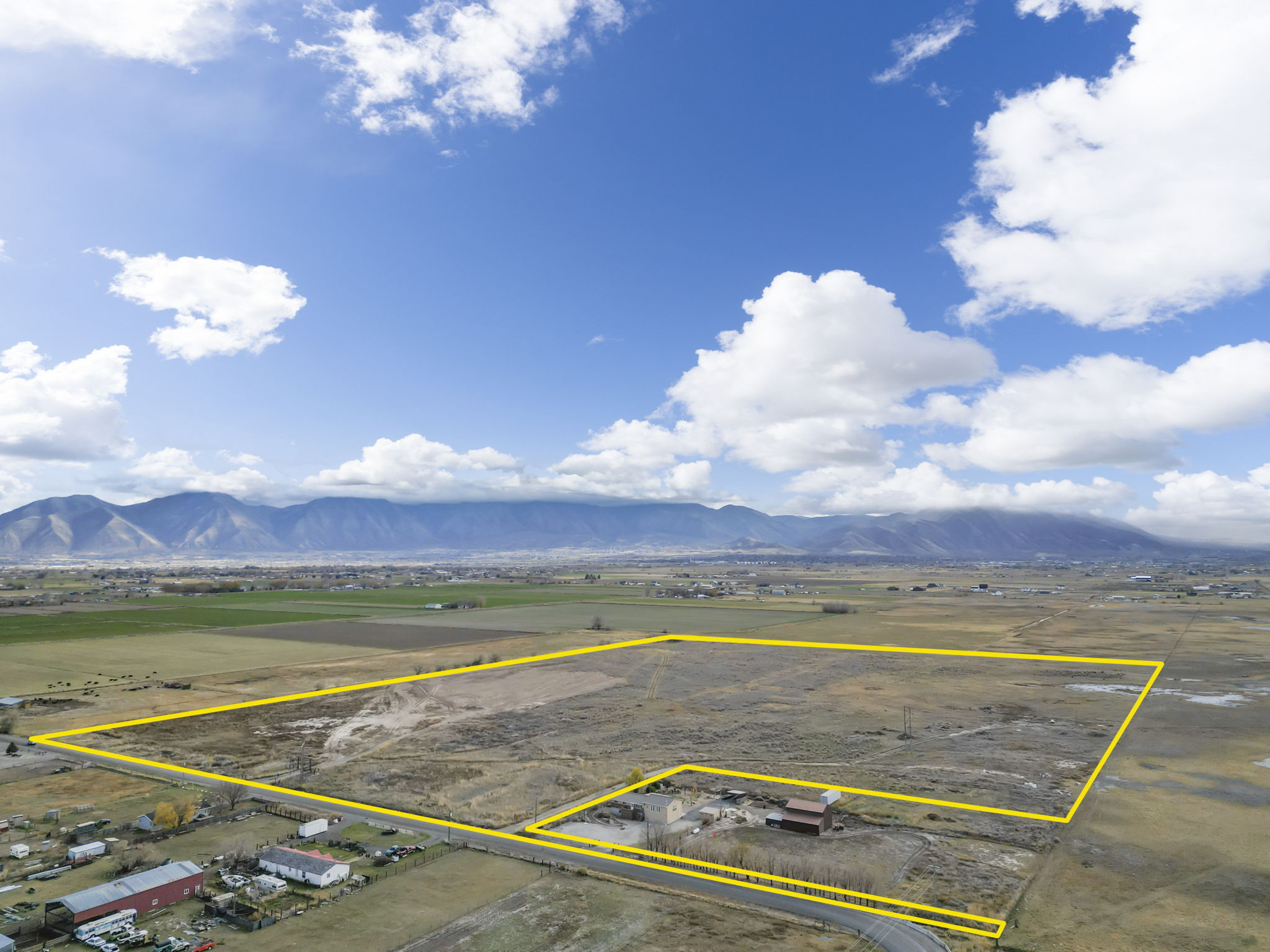 View of rural area featuring a mountain backdrop and property boundaries highlighted