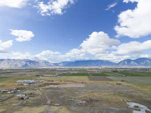 View of mountain background featuring rural landscape