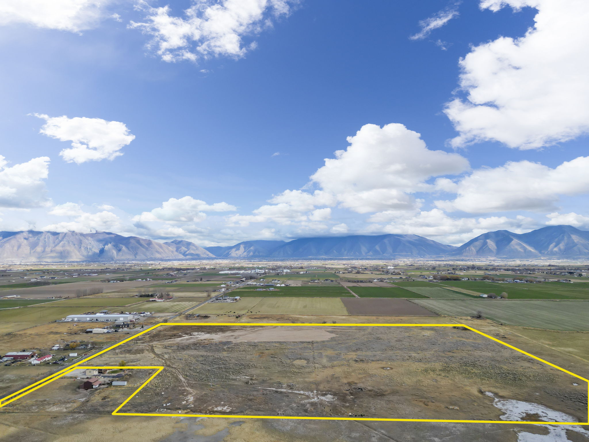 View of mountain background featuring rural landscape