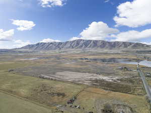 View of mountain backdrop with rural landscape