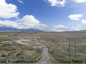 View of mountain background featuring rural landscape