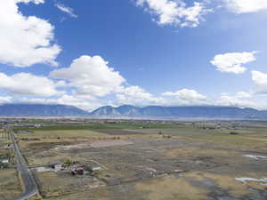 View of mountain backdrop with rural landscape