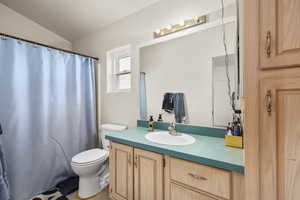 Bathroom featuring vanity and a shower with curtain