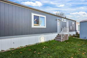 View of front of house with a front yard