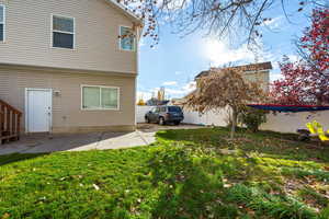 Back of house with a patio area