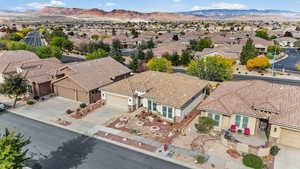 Aerial perspective of suburban area with a mountainous background