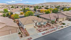 Aerial perspective of suburban area featuring a mountain backdrop
