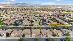 Aerial view of residential area featuring mountains