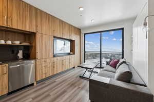 Living area with light wood-style flooring