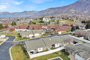 Aerial view of residential area featuring a mountainous background