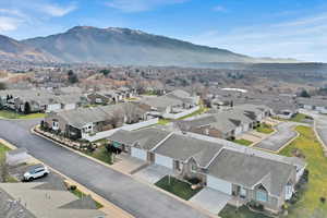 Aerial perspective of suburban area with a mountainous background