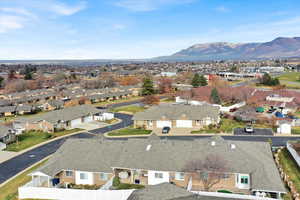 Aerial view of residential area featuring a mountain backdrop