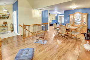 Dining space featuring light wood-style floors and a ceiling fan