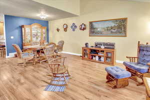 Living area with light wood-type flooring