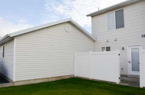 View of side of property featuring a yard