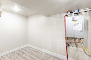 Utility room with tankless water heater and 96% efficient furnace