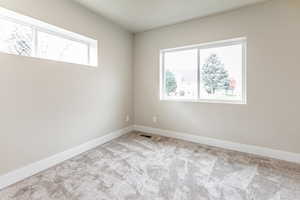 Bedroom room with carpet and baseboards