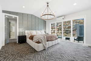 Bedroom featuring vaulted ceiling, access to outside, carpet floors, recessed lighting, and a chandelier