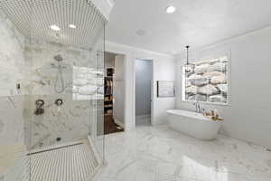 Bathroom with a freestanding tub, a marble finish shower, a textured ceiling, light marble finish floors, and recessed lighting