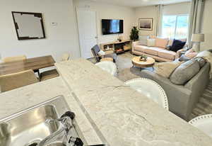 Living area featuring a lit fireplace