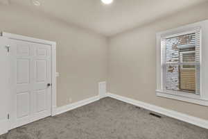 Spare room featuring carpet floors and recessed lighting