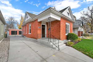 View of front of home with brick siding and concrete driveway