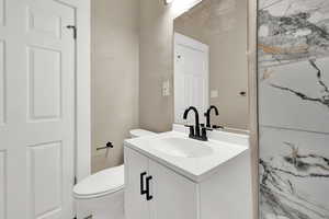 Bathroom featuring vanity and toilet