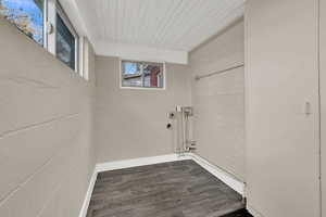 Laundry area featuring dark wood-style floors and washer hookup