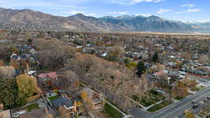 Aerial overview of property's location featuring a mountain backdrop and nearby suburban area