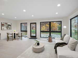 Living area featuring recessed lighting and light tile patterned floors