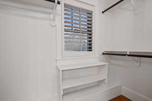 Spacious closet with wood finished floors