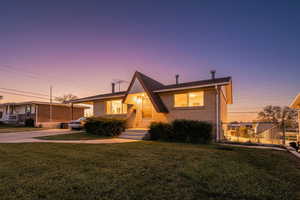 A-frame style home featuring brick siding