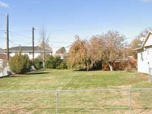 Fenced backyard with a garage