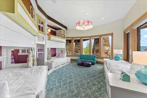 Bedroom featuring wallpapered walls, carpet, and recessed lighting