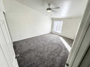 Unfurnished bedroom new carpet with ceiling fan