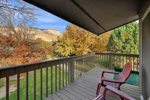 Deck featuring a yard and a mountain view