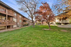 View of green lawn with a balcony