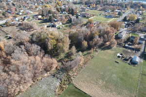 View of property location featuring nearby suburban area and rural landscape