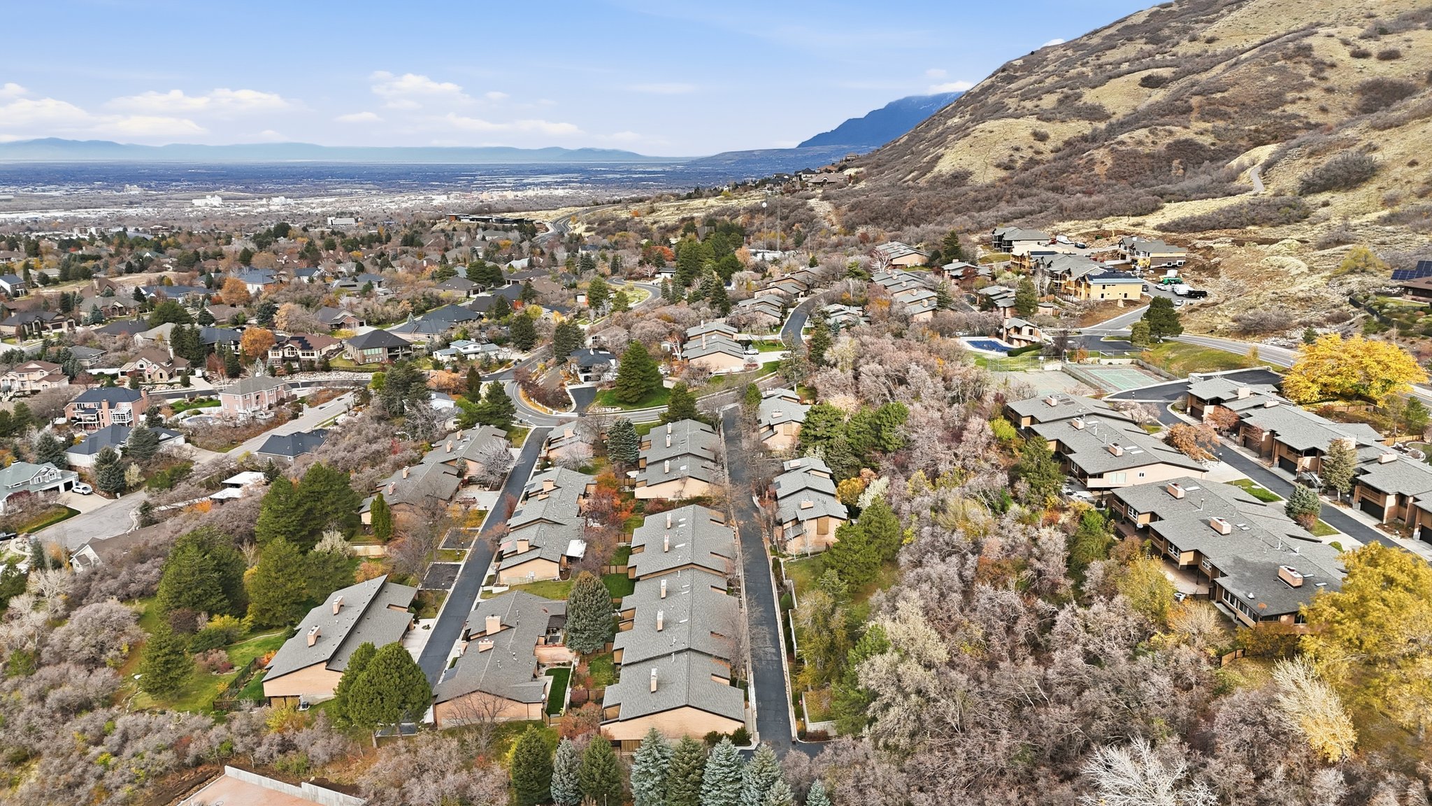 Aerial view of property's location with a mountainous background