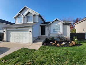 Traditional-style home featuring concrete driveway, an attached garage, brick siding, and a shingled roof