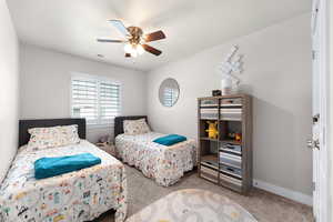 Bedroom with carpet floors and ceiling fan