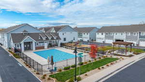 Community pool featuring a residential view and a patio